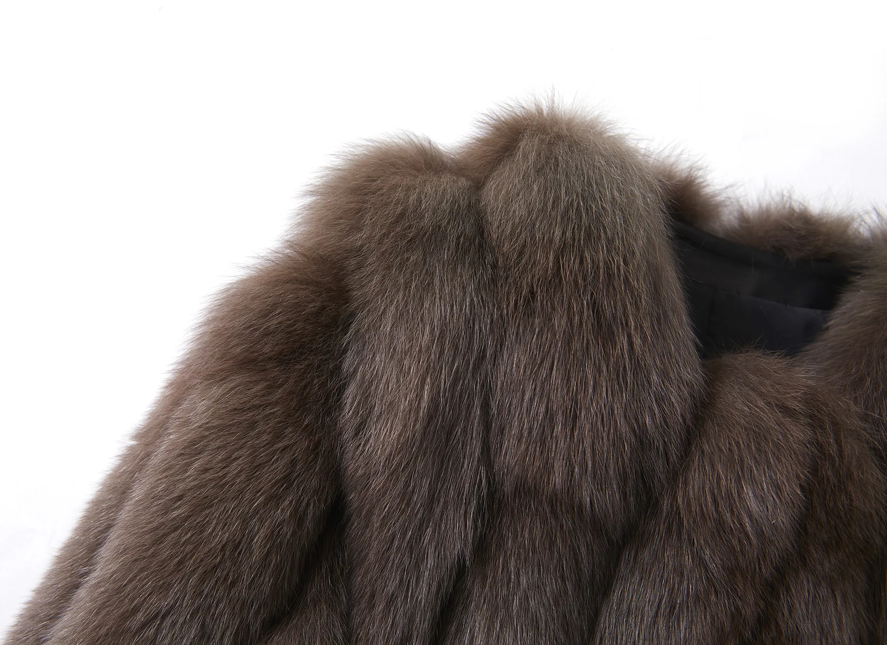 Close-up of dense brown fox fur with long lustrous guard hairs
