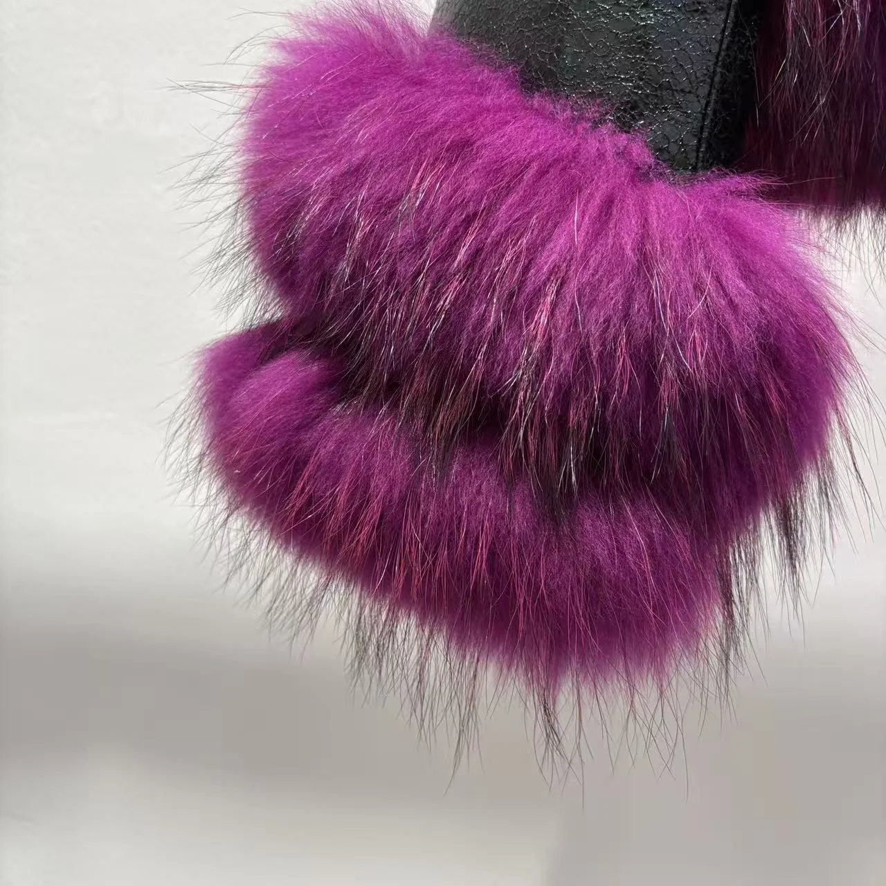 Black Leather Jacket with Raccoon Fur Trim — sleeve detail