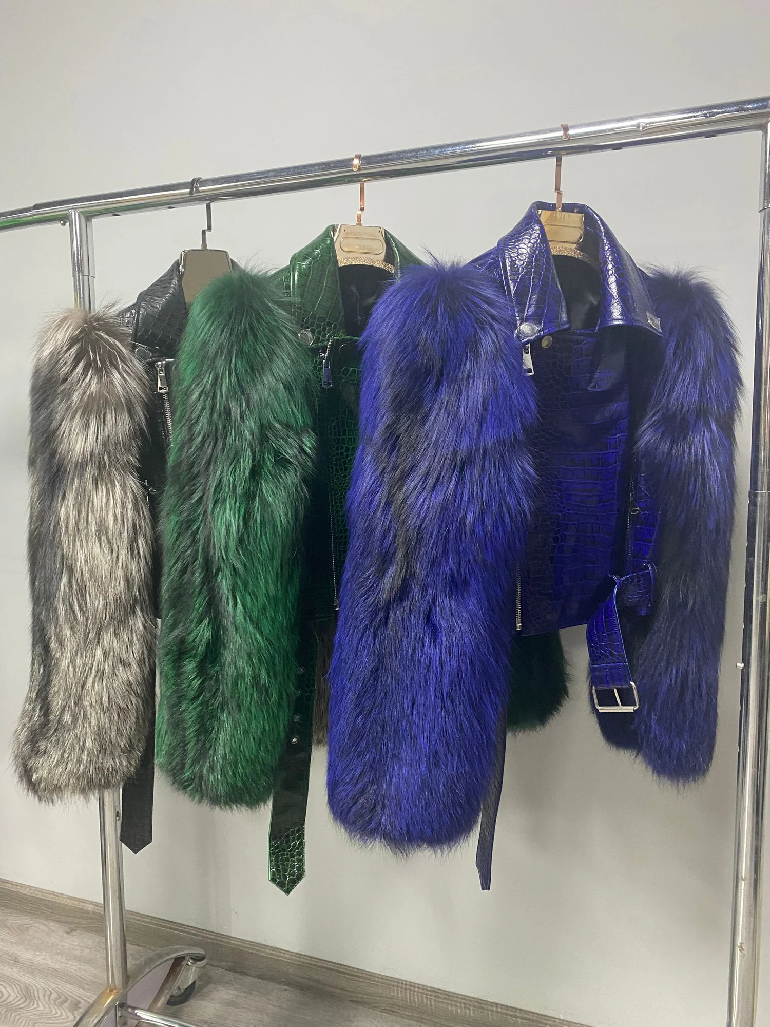 Multiple color references for the leather jacket with fox-fur sleeves