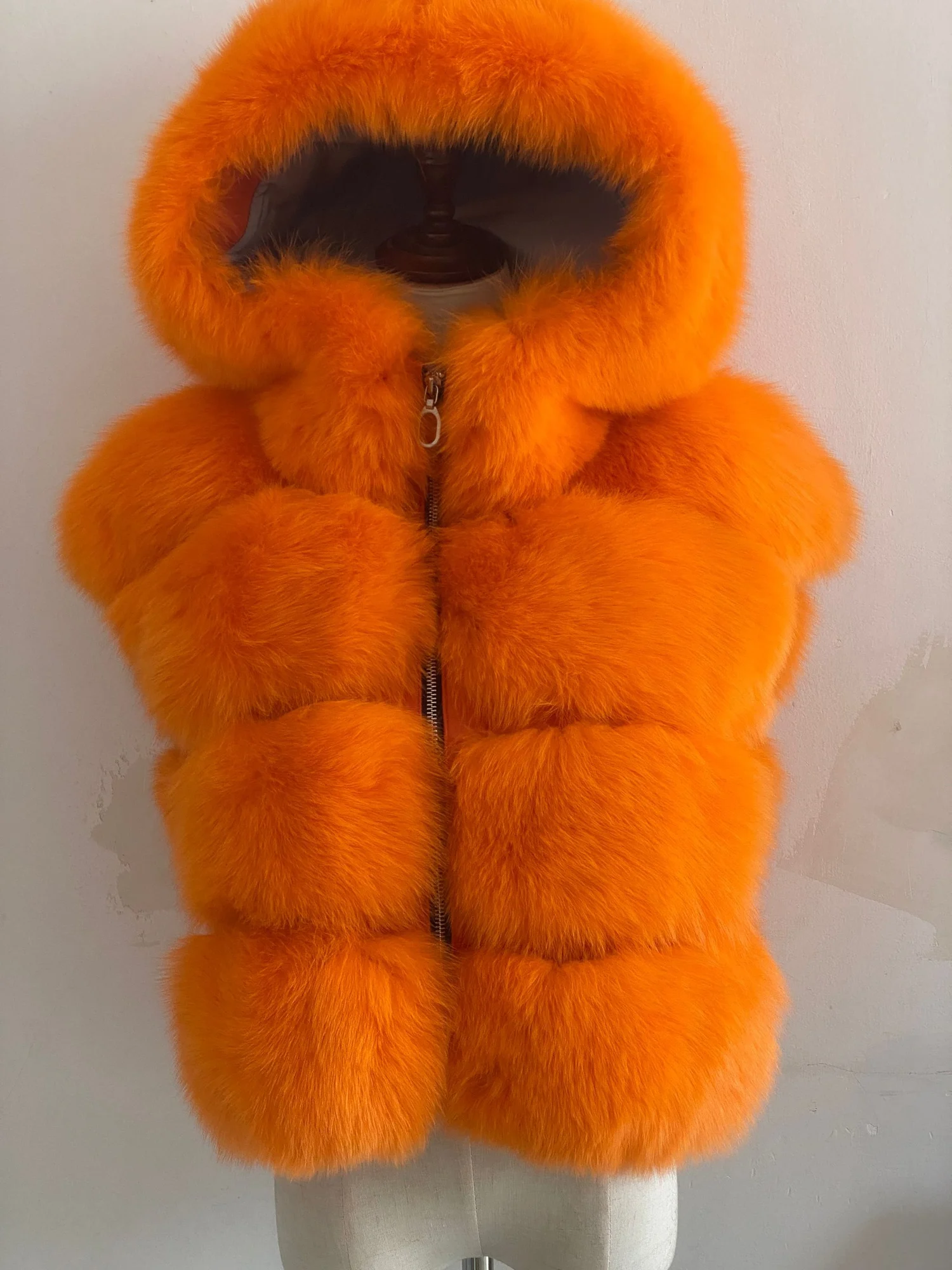 Orange hooded fox-fur vest front reference