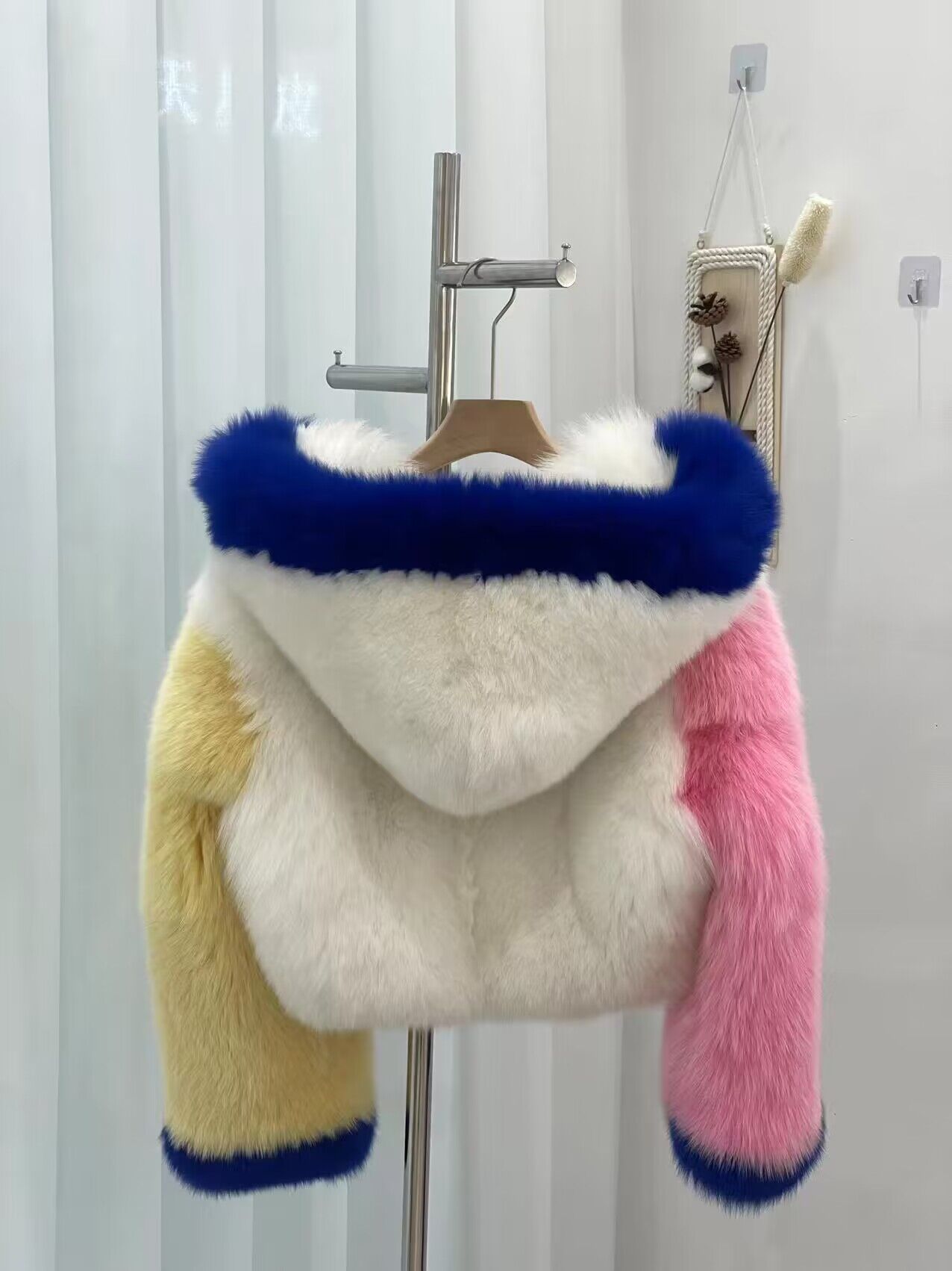 White cropped hooded jacket reference with blue pink and yellow color blocks